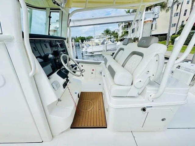 Slide: The Image of Interior of 2020 World Cat 32 boat with modern helm and comfortable seating. - 18