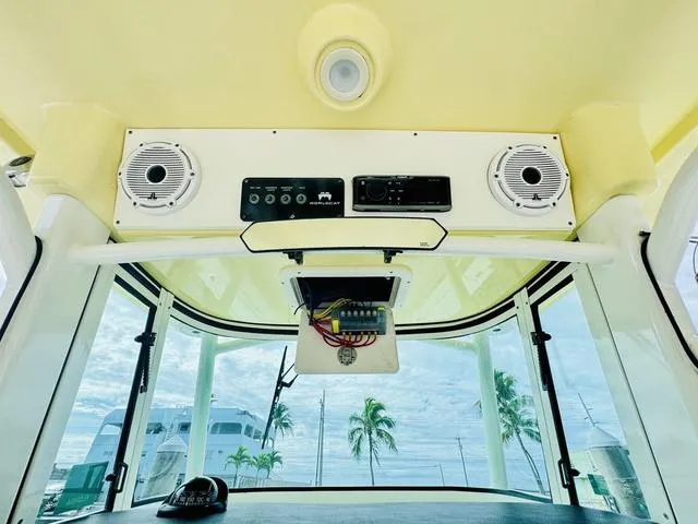 Slide: The Image of Interior view of 2020 World Cat 32 boat cockpit with speakers and control panel. - 21