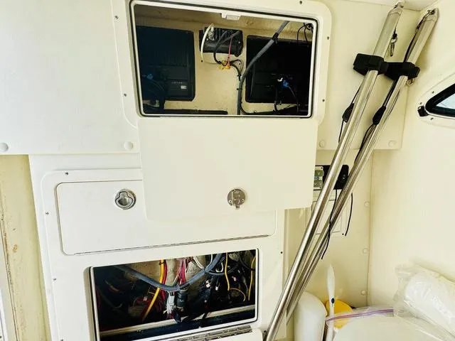 Slide: The Image of Interior view of a 2020 World Cat 32 boat showing storage compartments and equipment. - 24