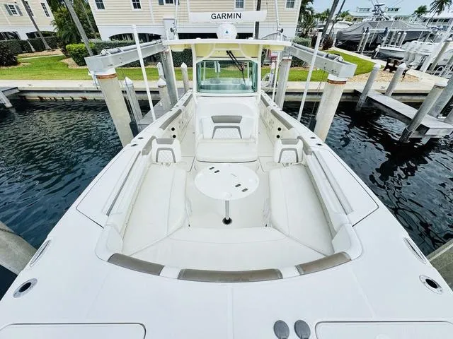 Slide: The Image of 2020 World Cat 32 boat with spacious seating, docked at marina. - 28