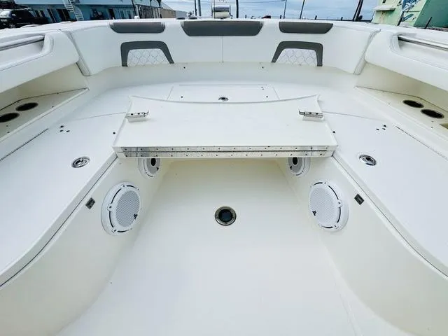 Slide: The Image of 2020 World Cat 32 boat interior with spacious seating and built-in speakers. - 30