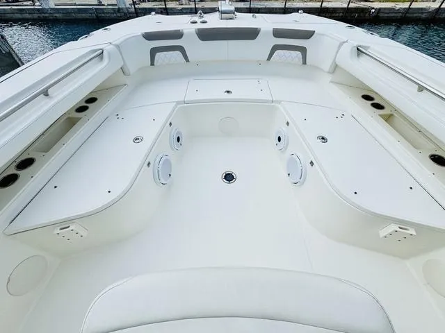 Slide: The Image of 2020 World Cat 32 boat interior with spacious seating and storage compartments. - 31