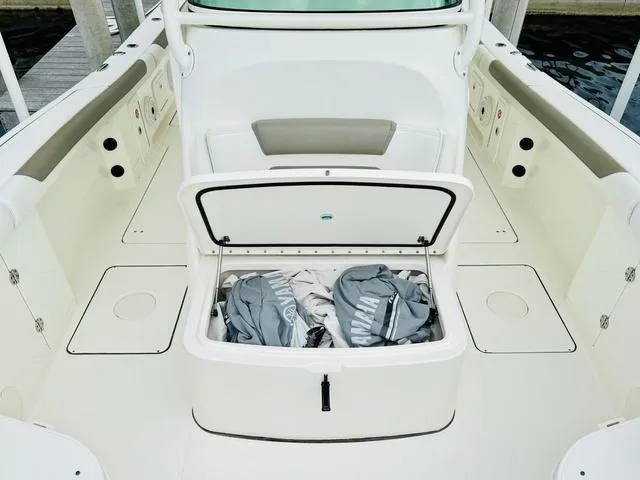 Slide: The Image of 2020 World Cat 32 boat interior with open storage compartment on deck. - 33