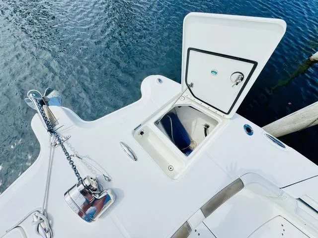 Slide: The Image of World Cat 32 boat deck with open storage compartment, anchor, and chain, 2020 model. - 35