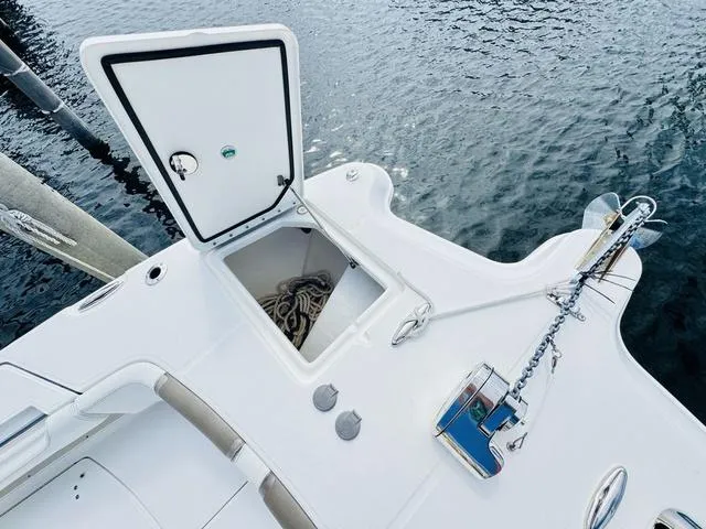 Slide: The Image of 2020 World Cat 32 boat deck with open storage compartment and anchor chain. - 36