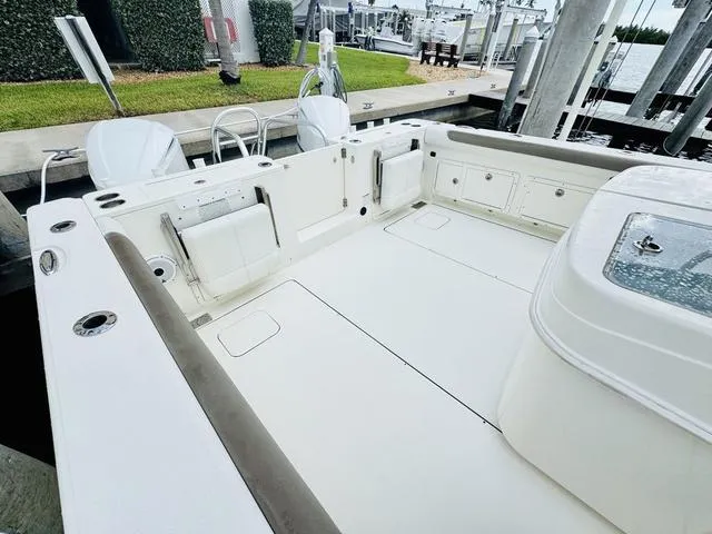 Slide: The Image of 2020 World Cat 32 boat deck with seating and storage, docked at marina. - 5
