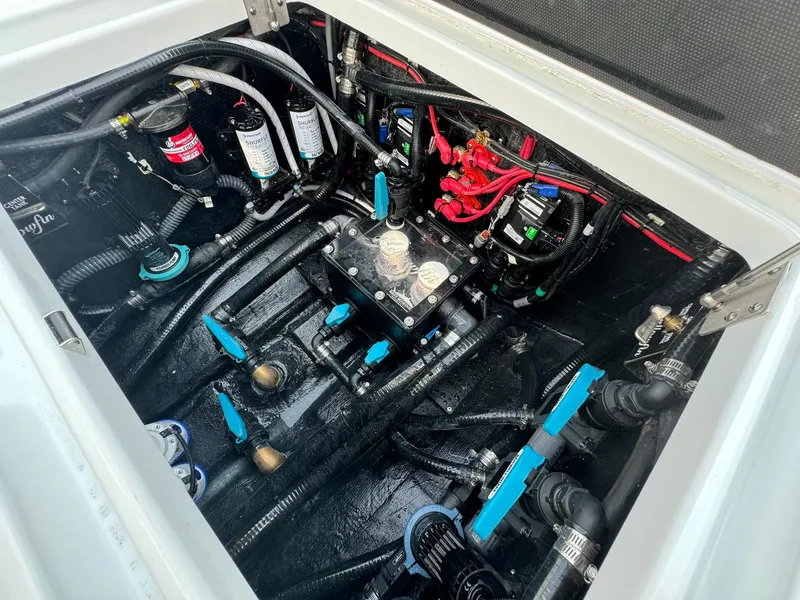 Slide: The Image of Engine compartment of 2025 Yellowfin 34 Offshore boat, showcasing wiring and components. - 29