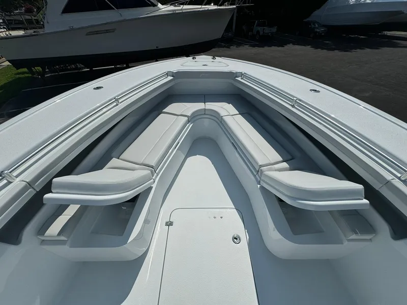 Slide: The Image of 2025 Yellowfin 34 Offshore boat with spacious seating area and sleek design. - 33