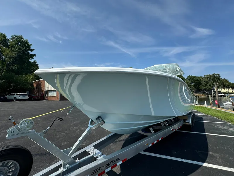 Slide: The Image of 2025 Yellowfin 34 Offshore boat on trailer under clear blue sky. - 9