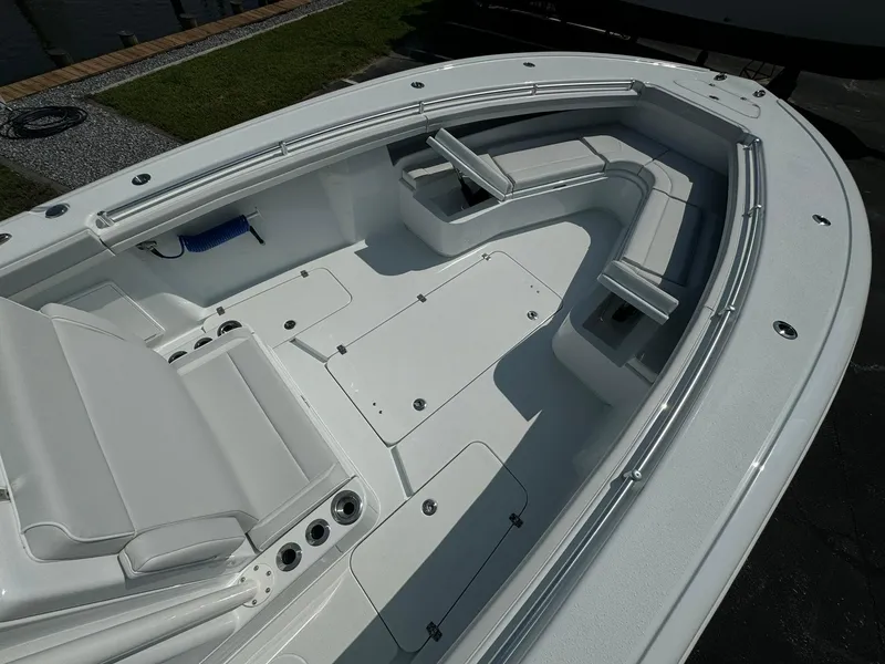 Slide: The Image of 2025 Yellowfin 34 Offshore boat interior with spacious seating and sleek design. - 15