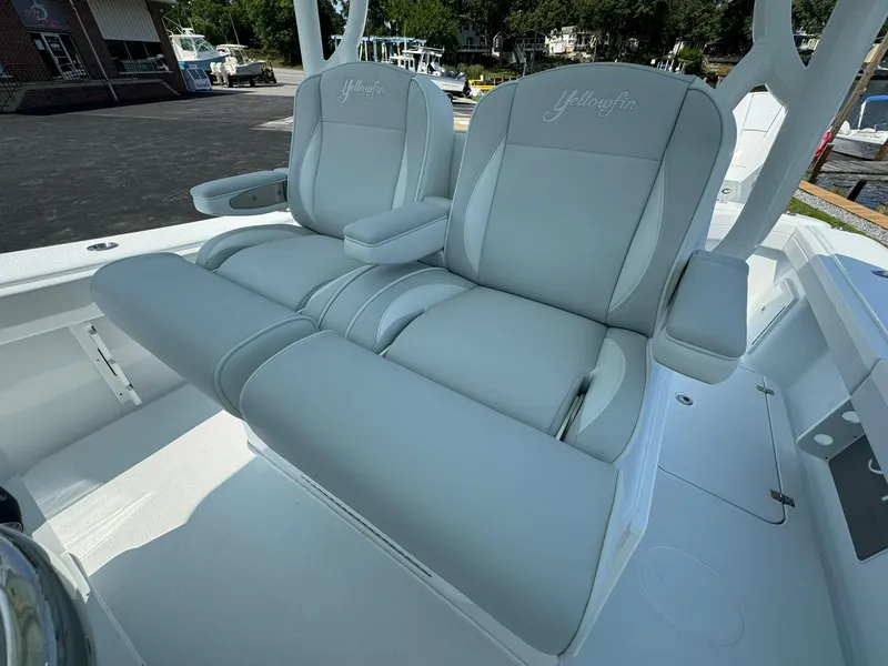 Slide: The Image of 2025 Yellowfin 34 Offshore boat with luxurious gray seating. - 21