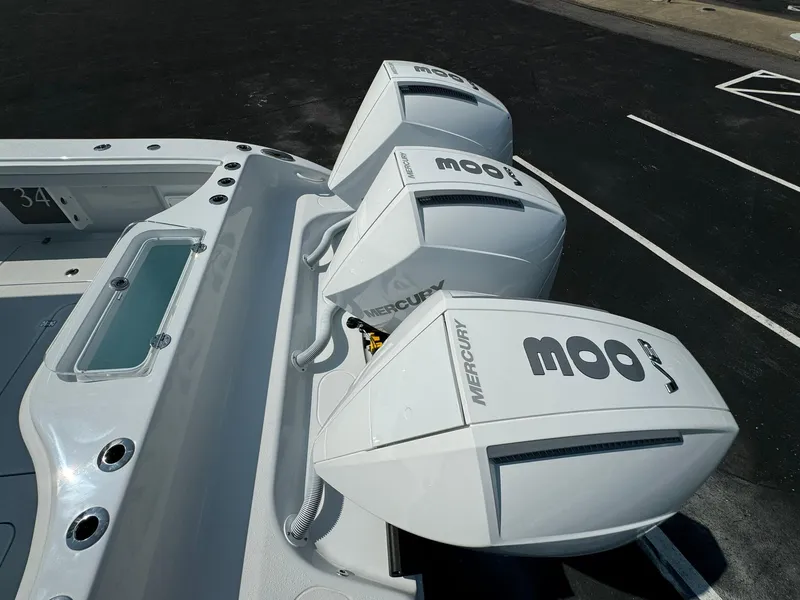 Slide: The Image of 2025 Yellowfin 34 Offshore boat with triple Mercury outboard engines. - 26