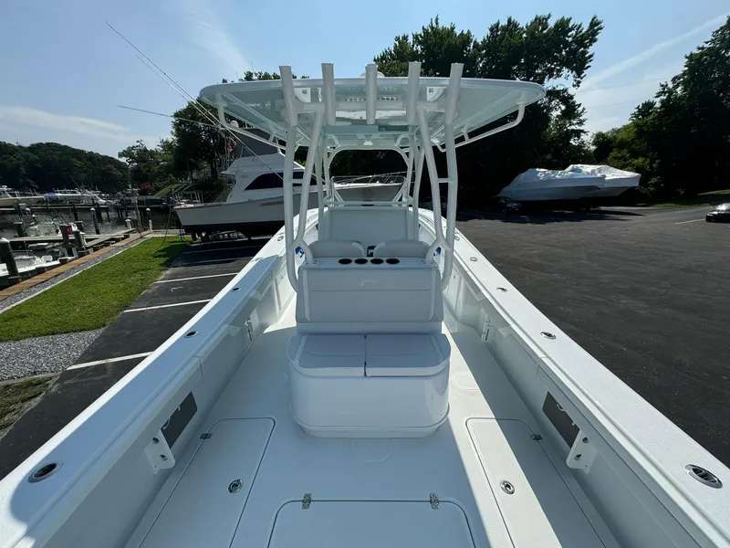 Slide: The Image of 2025 Yellowfin 34 Offshore boat with spacious deck and modern design at a marina. - 27