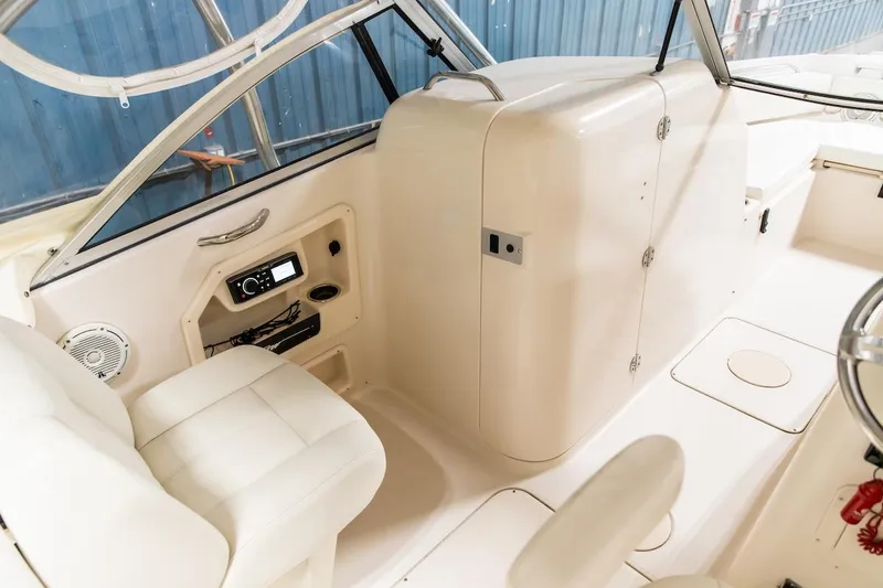 Slide: The Image of 2011 Grady-White Tournament 225 boat interior with seating and control panel. - 14
