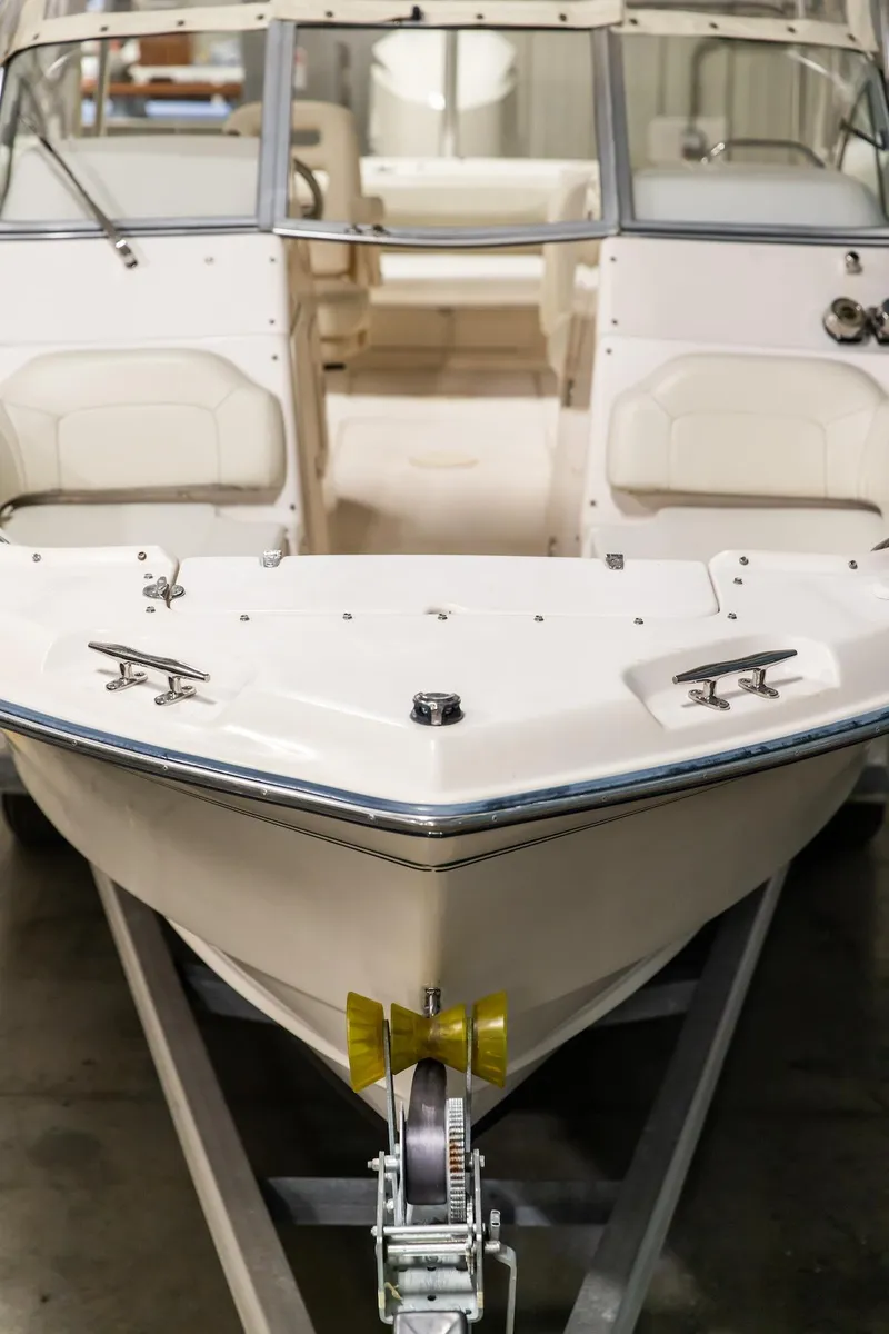 Slide: The Image of 2011 Grady-White Tournament 225 boat on trailer, front view in indoor setting. - 21