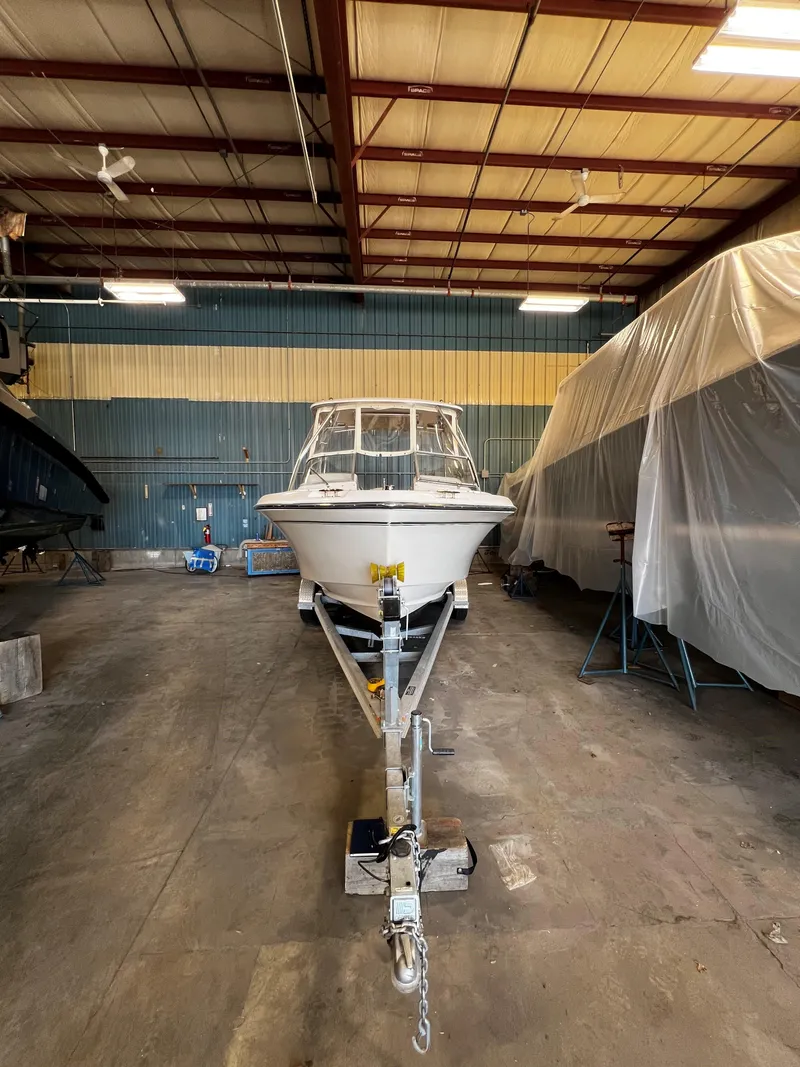 Slide: The Image of 2011 Grady-White Tournament 225 boat stored indoors on a trailer. - 26