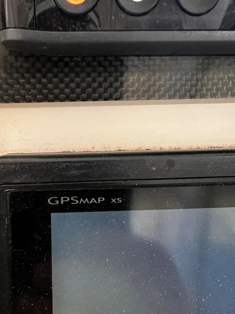 Slide: The Image of Close-up of a GPSMAP xs device on a 2011 Grady-White Tournament 225 boat. - 32