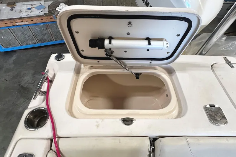 Slide: The Image of Open storage compartment on 2011 Grady-White Tournament 225 boat. - 37