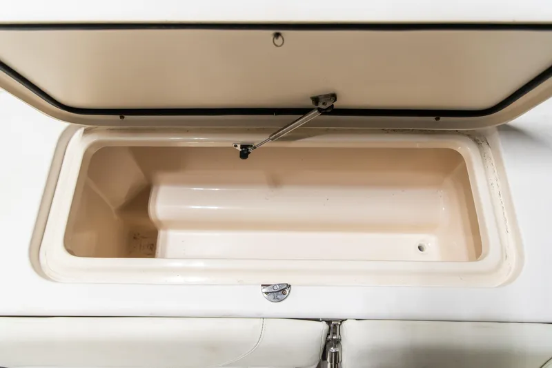 Slide: The Image of Open storage compartment on a 2011 Grady-White Tournament 225 boat. - 38