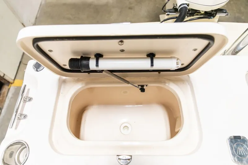 Slide: The Image of Open storage compartment on a 2011 Grady-White Tournament 225 boat. - 39