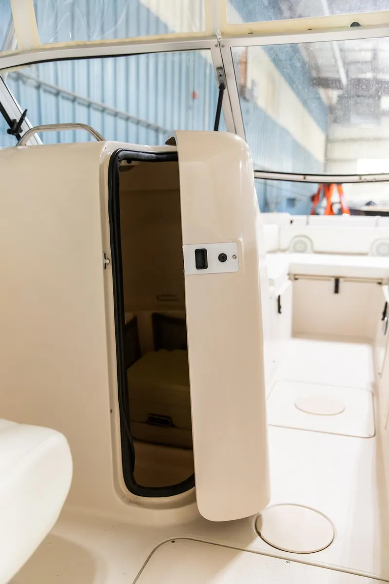 Slide: The Image of 2011 Grady-White Tournament 225 boat interior with open cabin door. - 44