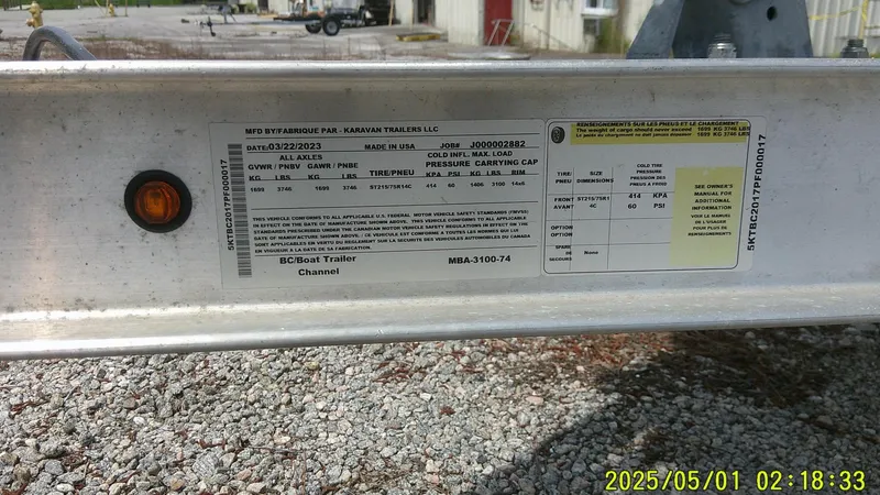 Slide: The Image of Trailer label on a Mako 18 LTS, 2023 model, with manufacturing details and specifications. - 26