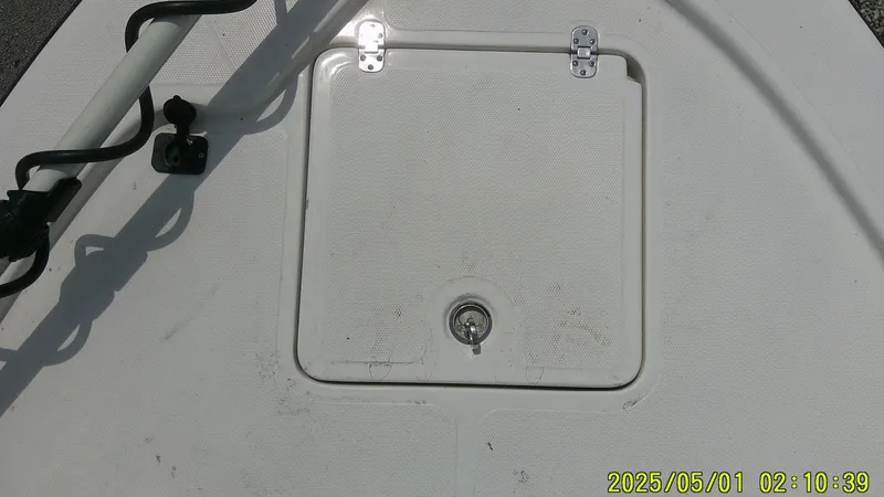 Slide: The Image of Hatch on 2023 Mako 18 LTS boat deck, with timestamp. - 29