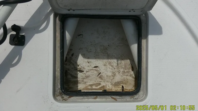 Slide: The Image of Open storage compartment on 2023 Mako 18 LTS boat, showing interior details. - 31