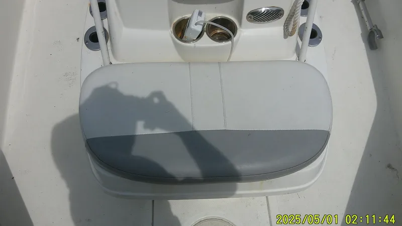 Slide: The Image of 2023 Mako 18 LTS boat seat with cup holders, shadow visible. - 4