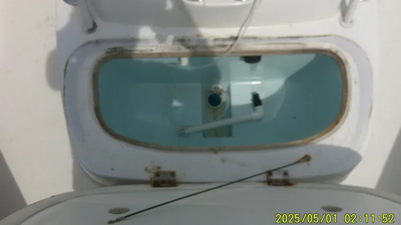 Slide: The Image of 2023 Mako 18 LTS boat livewell with water, viewed from above. - 5