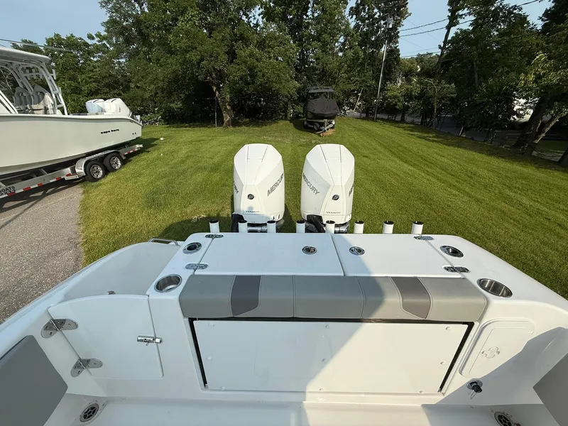 Slide: The Image of Cape Horn 32 XS 2025 boat with dual engines on grassy area. - 8