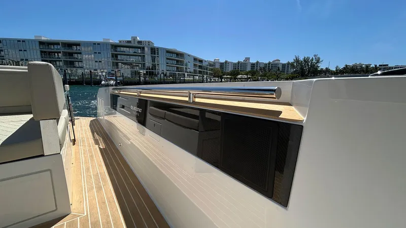Slide: The Image of 2025 De Antonio Yachts D36, sleek deck view, modern waterfront backdrop. - 13