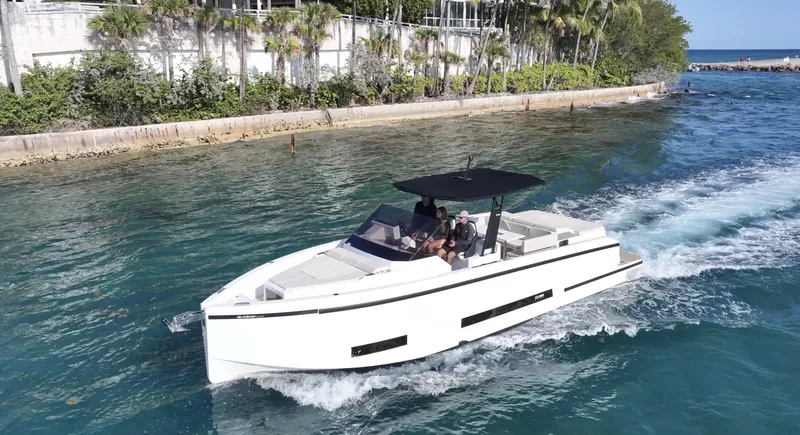 Slide: The Image of 2025 De Antonio Yachts D36 cruising on a scenic waterway. - 2