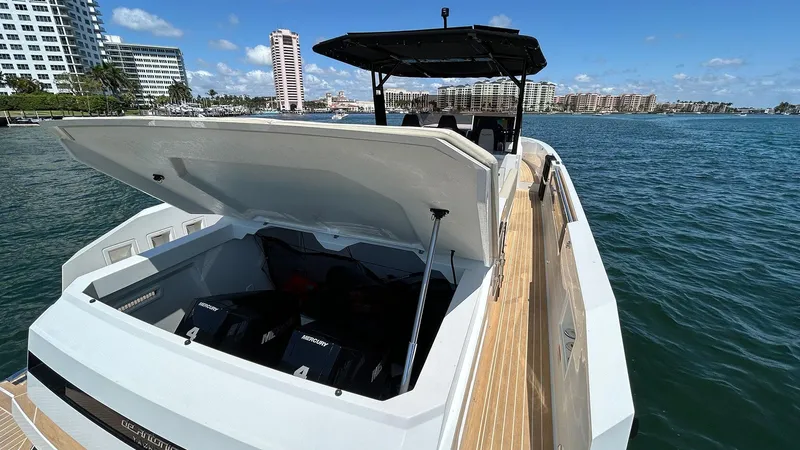 Slide: The Image of 2025 De Antonio Yachts D36 on water, open engine compartment, modern design, sunny day. - 24