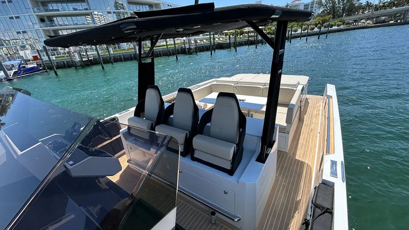 Slide: The Image of 2025 De Antonio Yachts D36 on water, featuring sleek design and modern seating. - 8