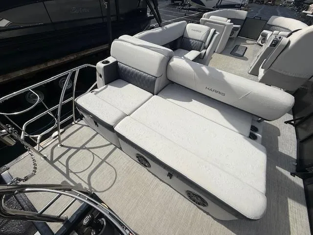 Slide: The Image of 2021 Harris Sunliner 250 boat with luxurious seating and modern design. - 3