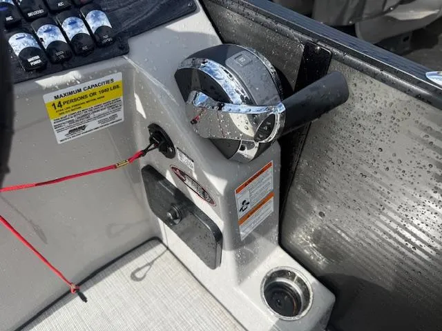 Slide: The Image of Control panel of 2021 Harris Sunliner 250 boat with throttle and capacity label. - 4