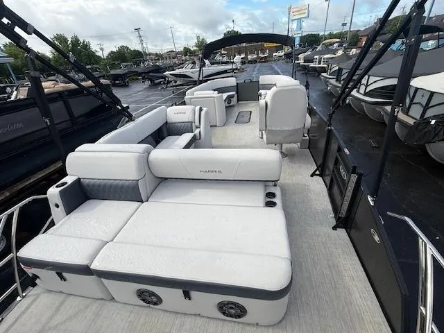 Slide: The Image of 2021 Harris Sunliner 250 pontoon boat with spacious seating and modern design. - 9