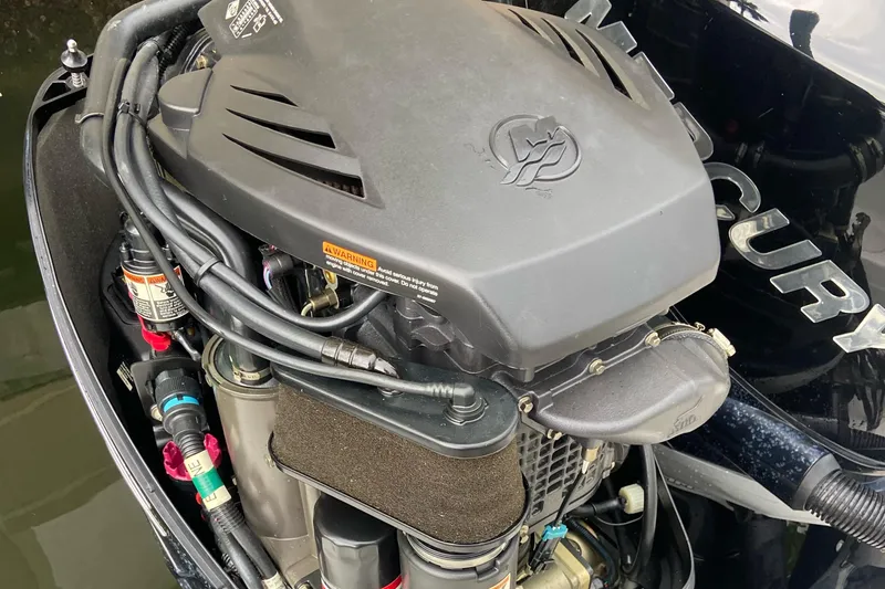 Slide: The Image of Engine of a 2013 Boston Whaler 270 Vantage boat, showcasing detailed components. - 18