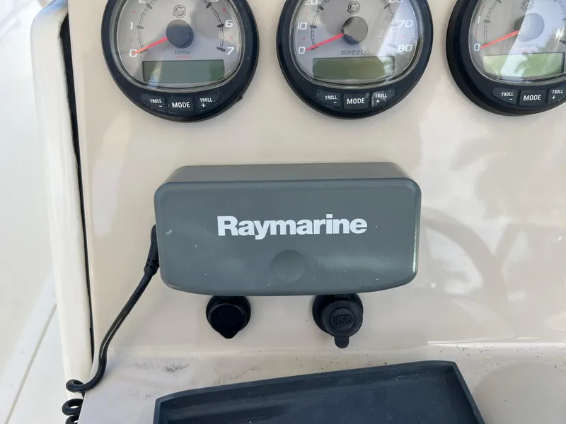 Slide: The Image of Dashboard of 2013 Boston Whaler 270 Vantage with Raymarine equipment and gauges. - 23