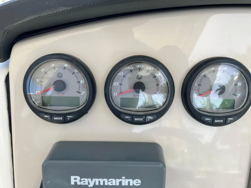Slide: The Image of Instrument panel of a 2013 Boston Whaler 270 Vantage boat with Raymarine display. - 24