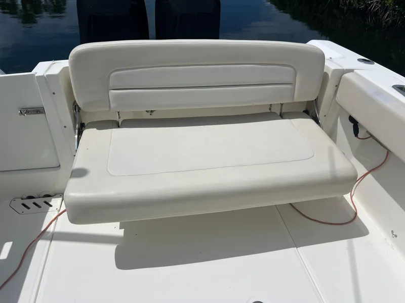 Slide: The Image of Boston Whaler 270 Vantage 2013 boat seat, white upholstery, outdoor setting. - 47