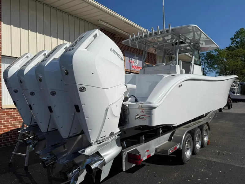 Slide: The Image of 2025 Yellowfin 39 Offshore boat with triple Mercury engines on a trailer. - 2
