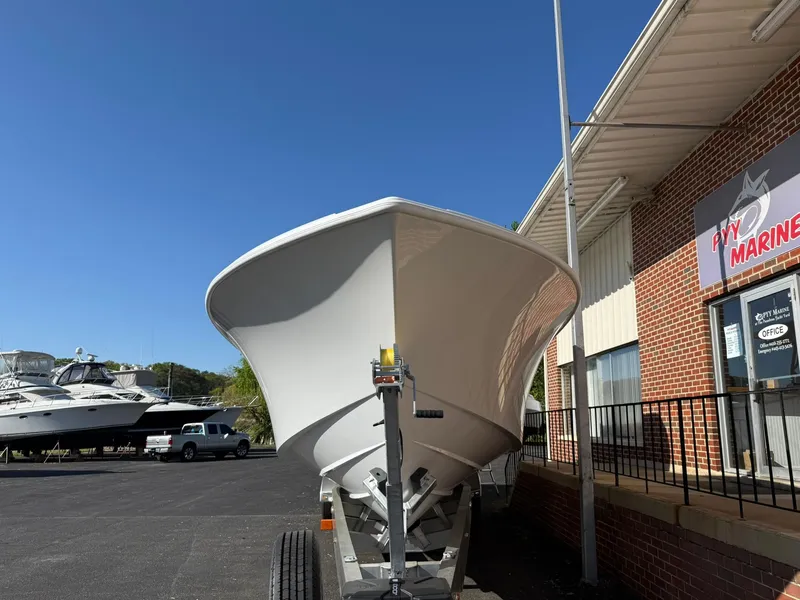 Slide: The Image of 2025 Yellowfin 39 Offshore boat on trailer outside marine shop. - 11