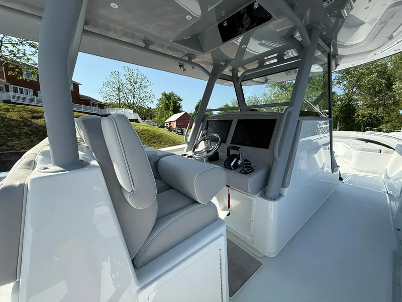 Slide: The Image of 2025 Yellowfin 39 Offshore boat interior with modern helm and seating. - 14