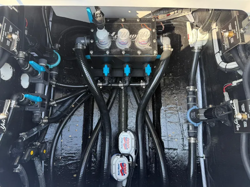 Slide: The Image of Engine compartment of 2025 Yellowfin 39 Offshore boat with complex wiring and components. - 19