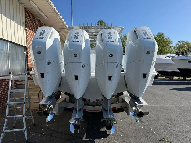 Slide: The Image of Four powerful outboard engines on a 2025 Yellowfin 39 Offshore boat, parked outdoors. - 4