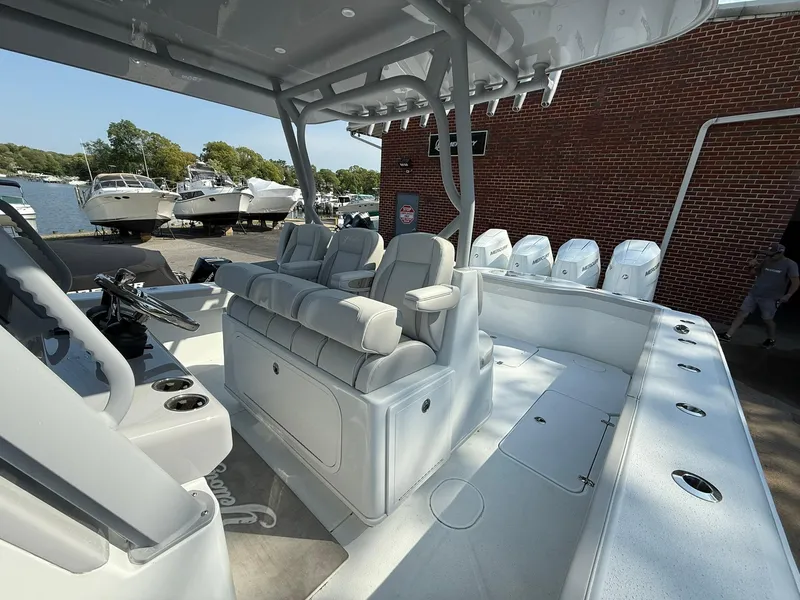Slide: The Image of 2025 Yellowfin 39 Offshore boat interior with seating and multiple outboard engines. - 16