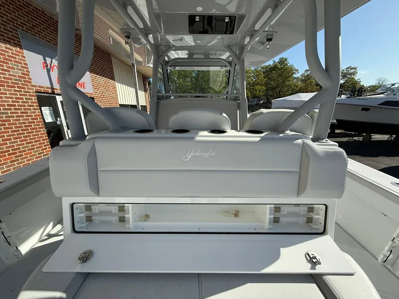 Slide: The Image of 2025 Yellowfin 39 Offshore boat interior with seating and storage compartment. - 5