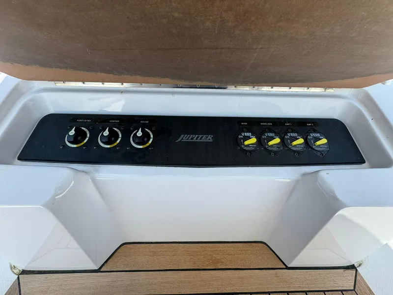 Slide: The Image of 2024 Jupiter 340LS boat control panel with knobs and switches. - 27